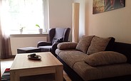 Wohnzimmer mit Schlafsofa