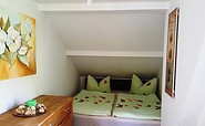 Schlafzimmer mit Doppelbett, Foto Simone Brose