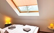 Ferienwohnung Filu: Schlafbereich mit Doppelbett, Foto: Ulrike Haselbauer, Lizenz: Tourismusverband Lausitzer Seenland e.V.