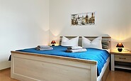 Holiday flat Jacko: Bedroom with double bed, Foto: Ulrike Haselbauer, Lizenz: Tourismusverband Lausitzer Seenland e.V.