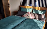 Schlafzimmer in der Ferienwohnung fries-Style, Foto: Kathrin Schilling