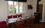 Essecke mit Kamin, Foto: Ferienhaus &quot;Märkische Schweiz Baude&quot;