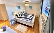 Zweites Schlafzimmer mit 180x200 Bett, Foto: Hüller