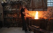 The blacksmith at the fire, Foto: Julia Luise Schulz, Lizenz: Metallgestaltung Geislberger