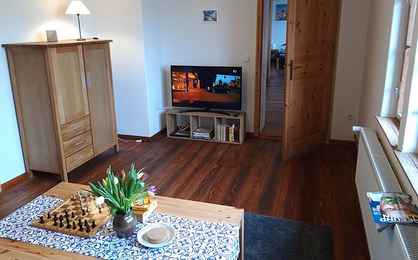 Living room with view into the kitchen, Foto: R. Müller-Zetzsche