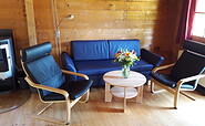 Log cabin, living room, Foto: Meike Holstein , Lizenz: Brennickenswerder GmbH u. Co.KG