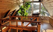 attic with relaxation area, Foto: Thea Hanspach