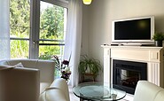 TV und Elektrokamin im Schlafzimmer, Foto: Ulrike Haselbauer, Lizenz: Tourismusverband Lausitzer Seenland e.V.