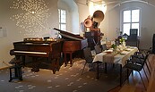 Der unsichtbare Pianist im Kaffeehaus, Foto: Burg Beeskow, Lizenz: Burg Beeskow